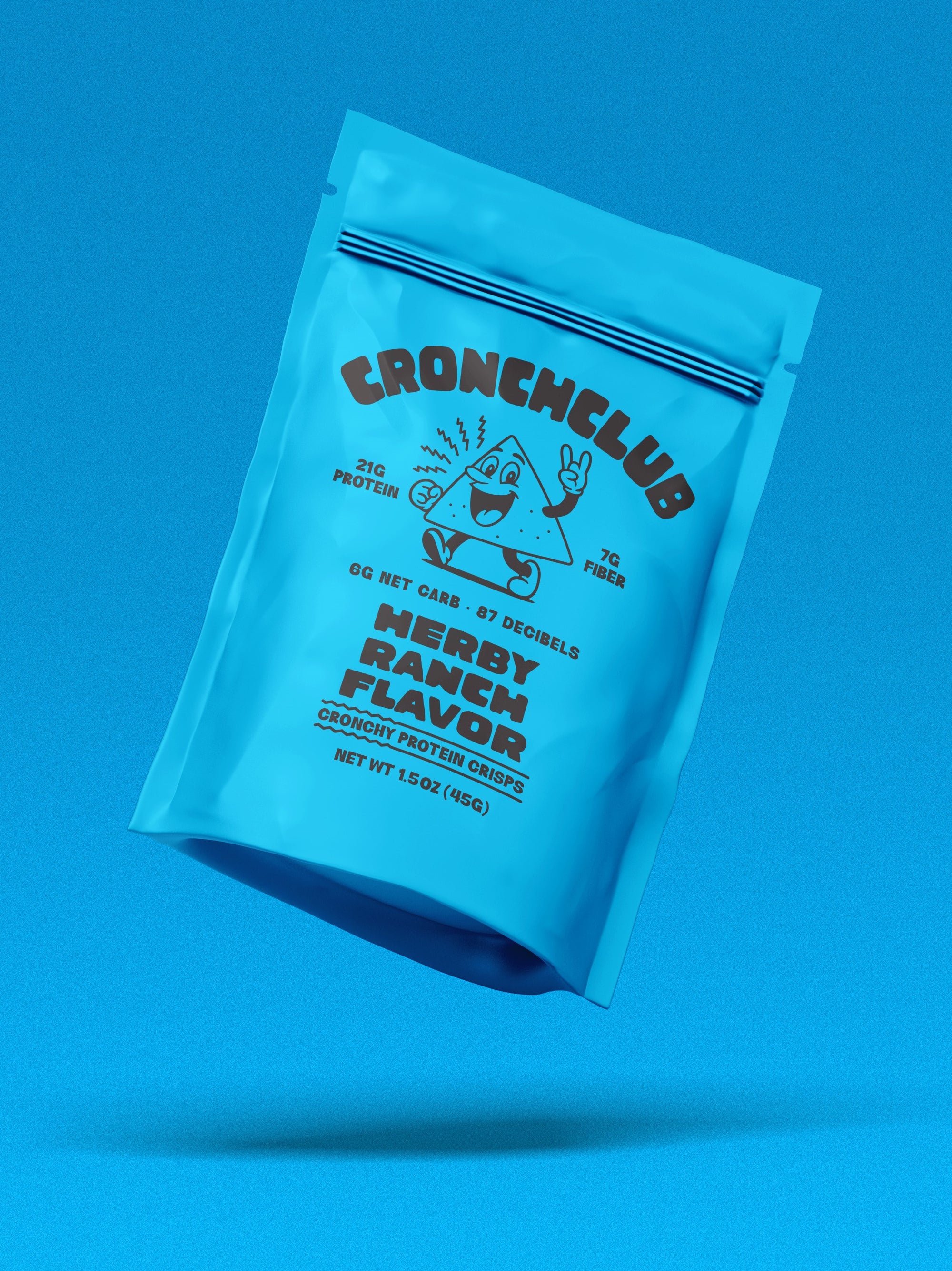Floating blue Cronchclub bag against a matching blue background. Herby Ranch Flavor. The mascot Cronchy is shown next to text reading '21g Protein' and '87 Decibels'